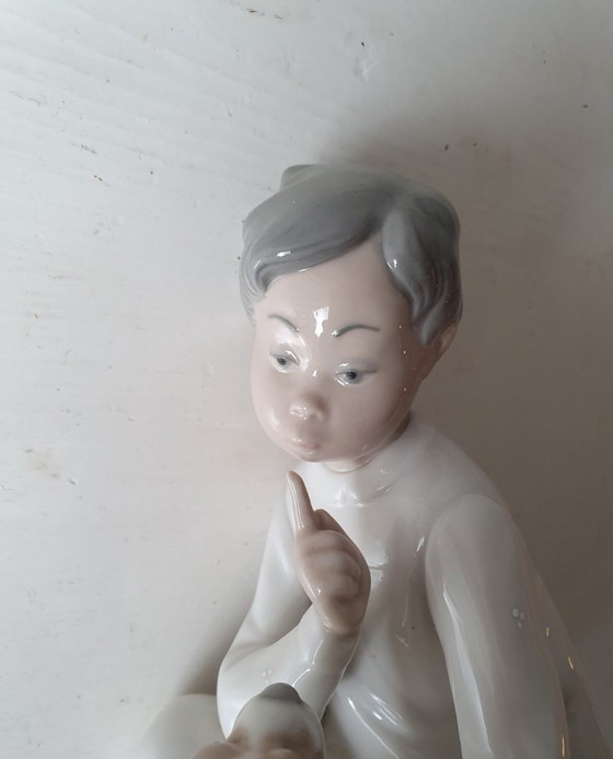 Image 1 of Authentic Lladro "Boy with dog" - porcelain figurine 20 cm
