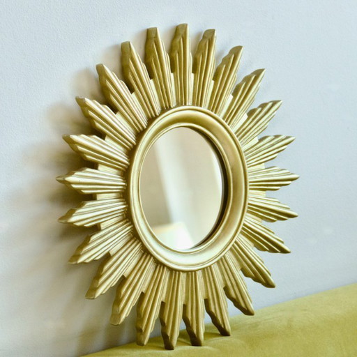 Vintage gold-colored sunburst mirror
