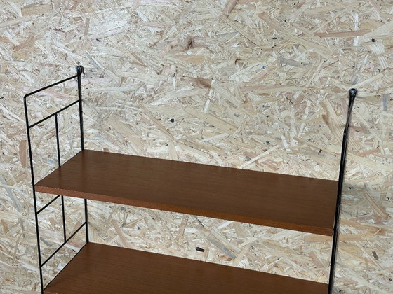 Image 1 of Anni '60-'70 scaffale in teak Scaffale a muro WHB Germania Scaffale a corda Design danese