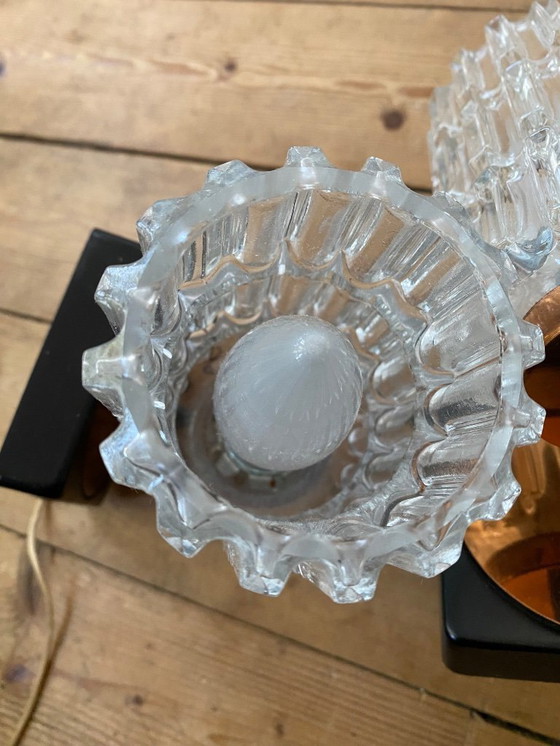 Image 1 of Een paar vintage koperen wandlampen van Phillips uit de jaren 70.