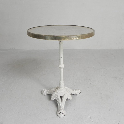 Mesa de bistró con patas de hierro fundido y tablero de mármol, década de 1920.