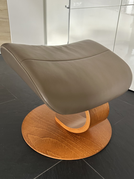 Image 1 of Taupe armchair with footstool