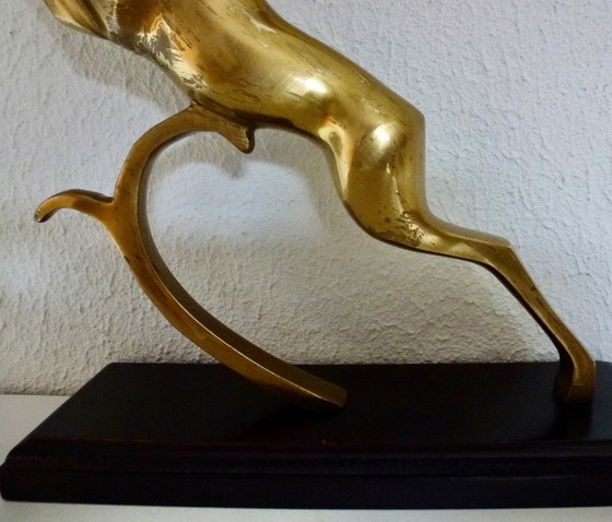 Image 1 of Beautiful brass gazelle on a lacquered wooden base.
