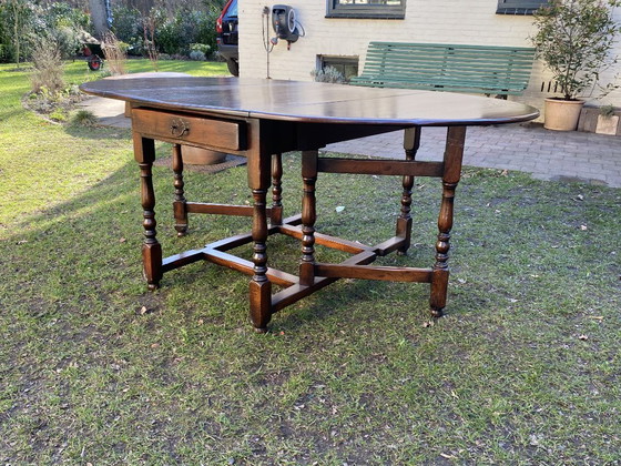 Image 1 of Antique English gateleg table, solid wood, oval, extendable