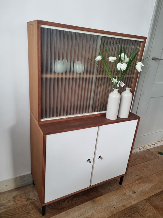 Image 1 of Set of two vintage cabinets with ribbed glass – warm wood & white (mid-century look)