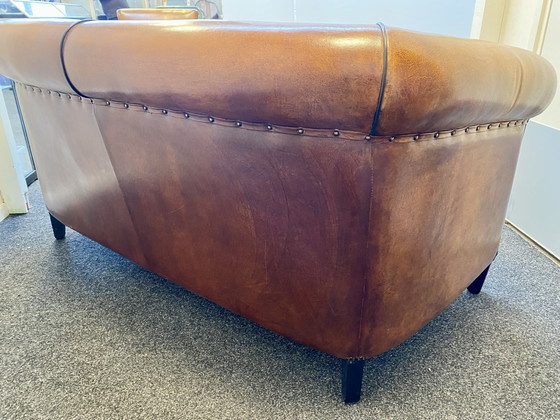 Vintage sheepskin leather sofa + armchair – Lounge Atelier, Seating area, Wood (photo 12 of 14)