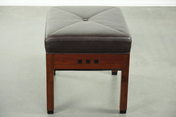 Image 1 of Chocolate brown cowhide Schuitema Art Deco design ottoman/footstool from the Decoforma series