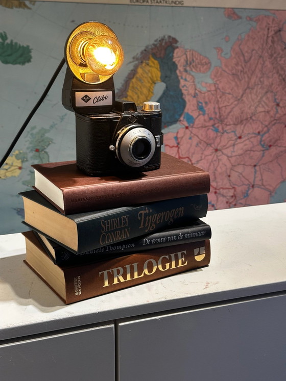 Unique camera table lamp on a stack of books – Glass, Metal (photo 2 of 8)