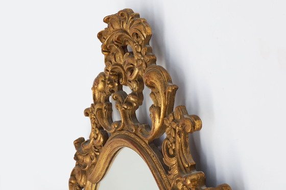 Image 1 of Baroque style oval wall mirror in gilded wood, France