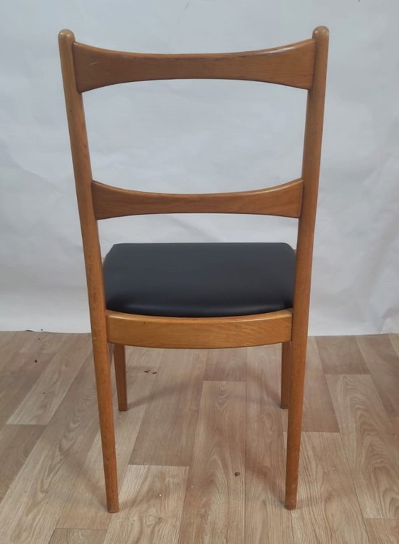 Image 1 of Vintage Danish teak chair - black leatherette seat (60's)