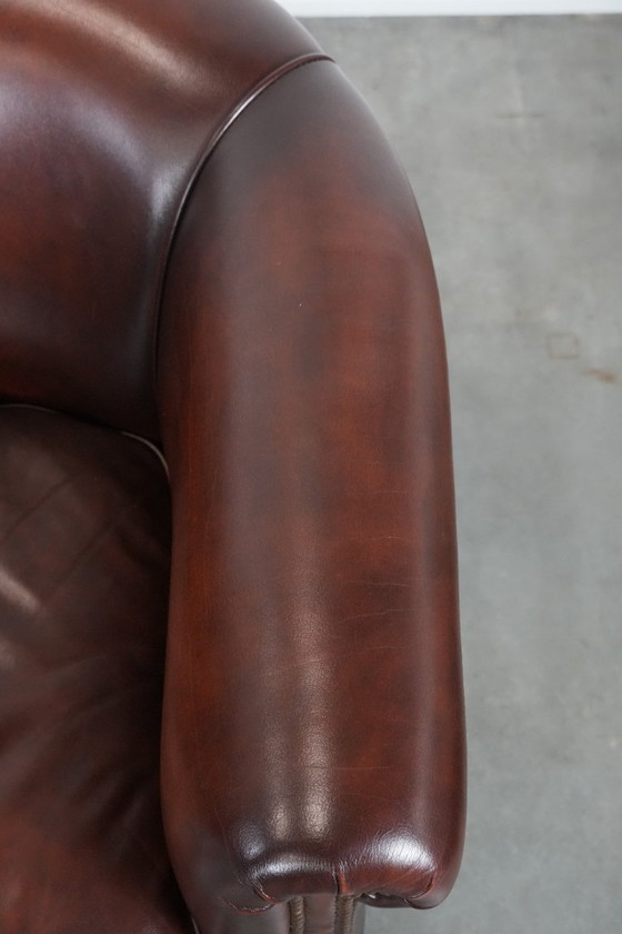 Image 1 of 2 poltrone club in pelle bovina in buone condizioni, di un lussuoso colore rosso/marrone.