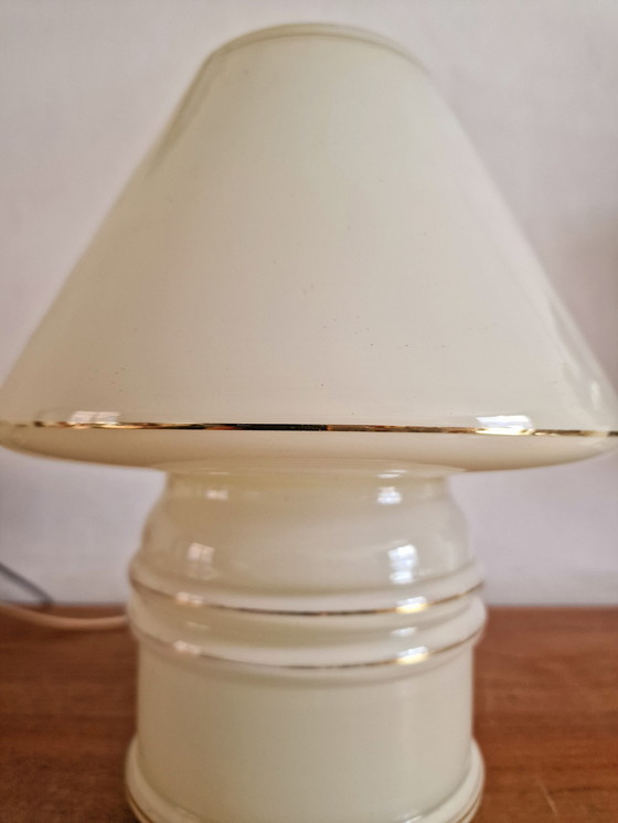 Image 1 of Vintage table lamp by Massive, with a glass base and shade.

With gold accents