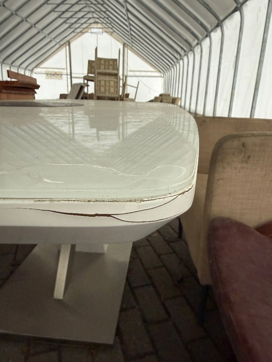 Image 1 of Contemporary white wooden dining table with stainless steel details and a 40 cm folding tabletop section