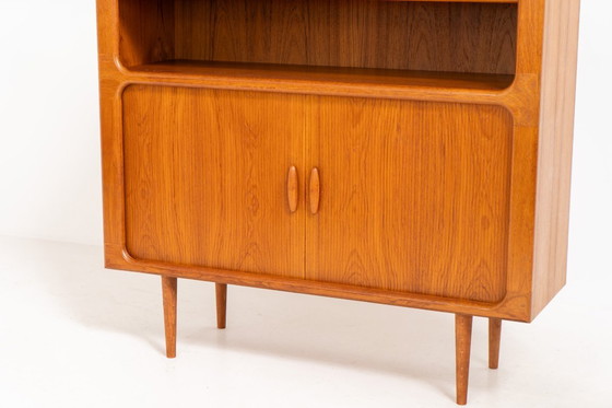 Image 1 of Bookcase in teak by Svend Dyrlund with tambour doors (Denmark, 1960s).