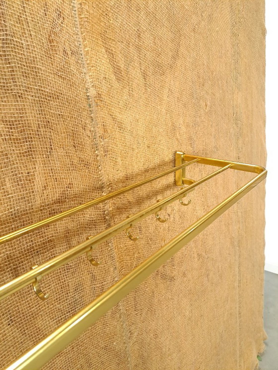 Image 1 of Porte-manteau en forme de train, couleur or, avec crochets, n° 18