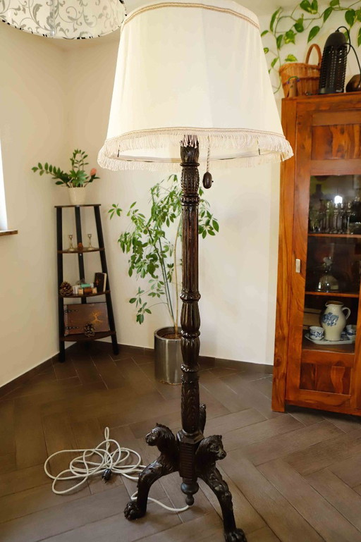 Antique floor lamp with lion motif 