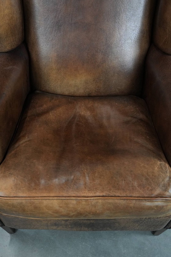 Image 1 of Comfortable vintage sheepskin wing chair with character