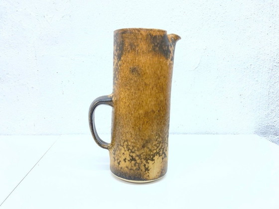 Image 1 of   1 jug and 4 mugs from the 50s 60s by Gotlind Weigel.  Ceramic.  Good used condition. Some chips to the rim