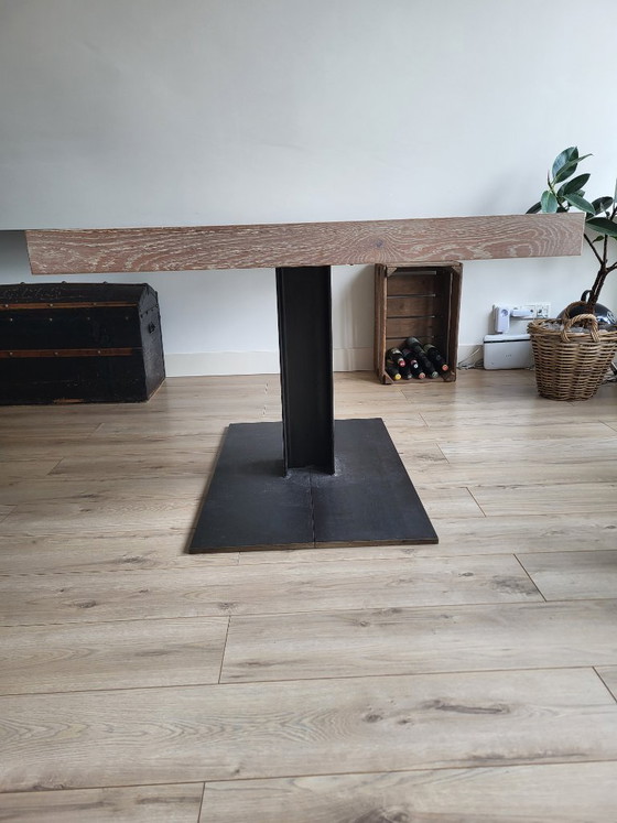 Image 1 of Wooden table with cast iron leg