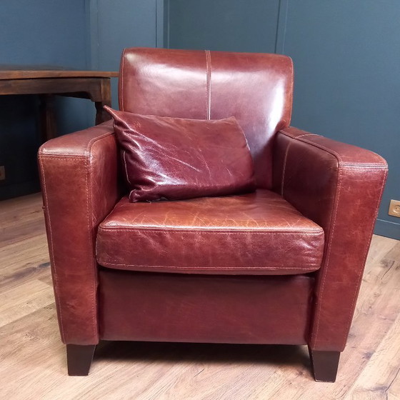 Image 1 of Timeless cowhide leather club armchair, atmospheric and inviting.