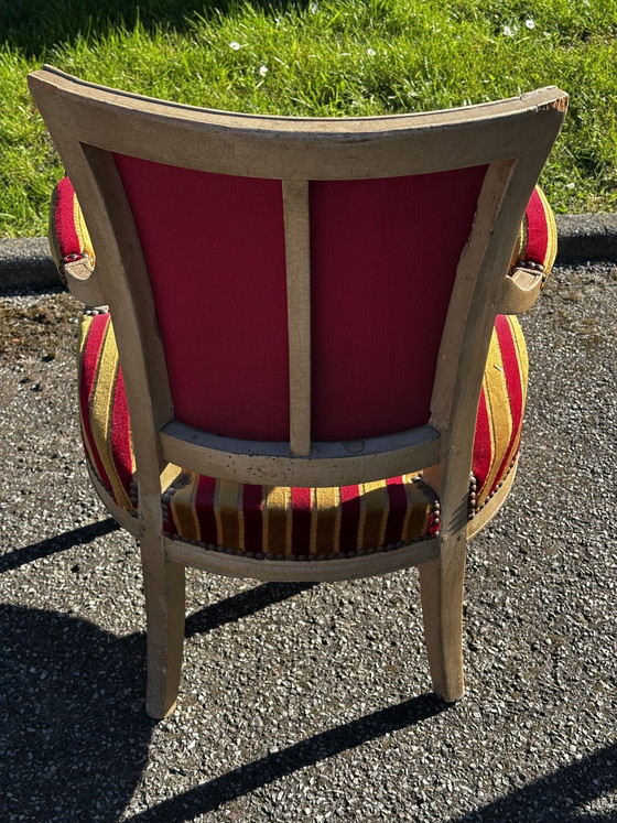Image 1 of Louis XVI cabrioletfauteuil - Gepatineerd hout en gestreept fluweel