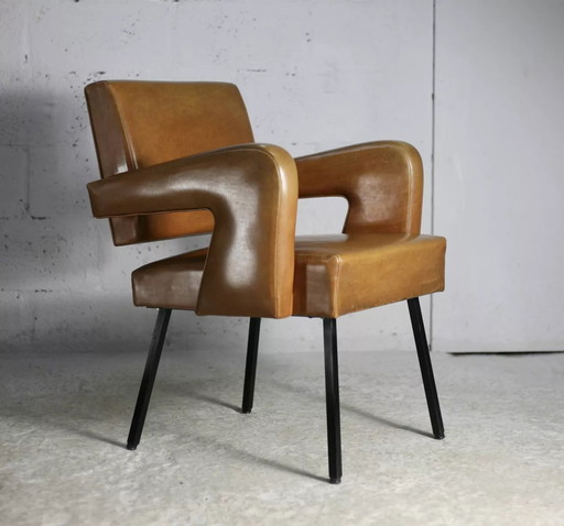 Armchair in the style of Jacques Adnet