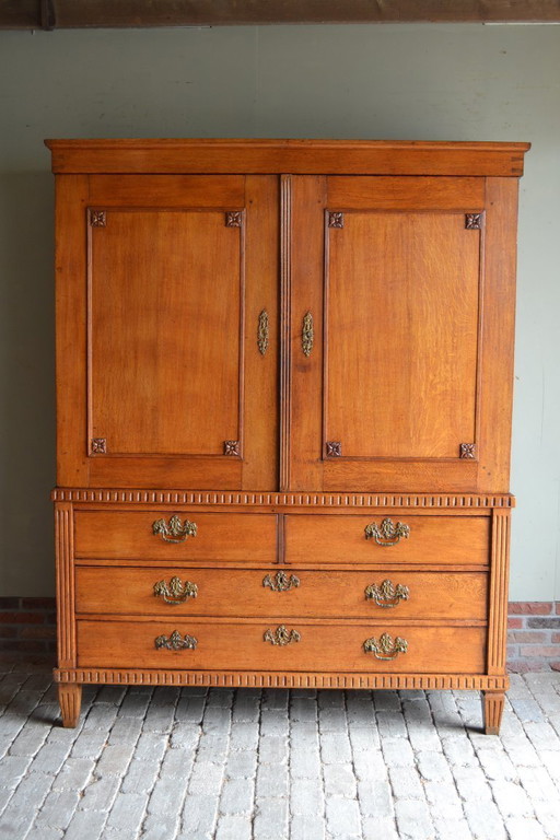Antique oak wood Empire cabinet.