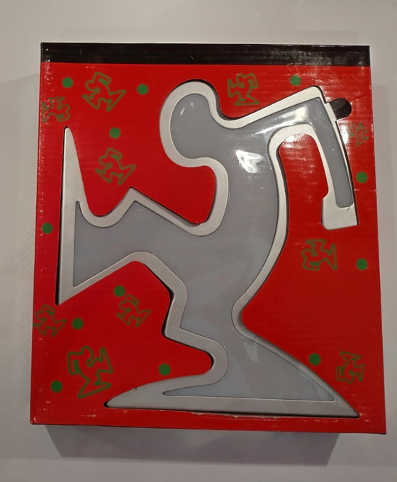 Image 1 of Lámpara Keith Haring La Línea Osvaldo Cavandoli Plateada (Nueva en su embalaje original)