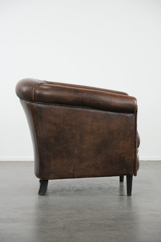 Image 1 of Sturdy and characterful vintage sheepskin club armchair