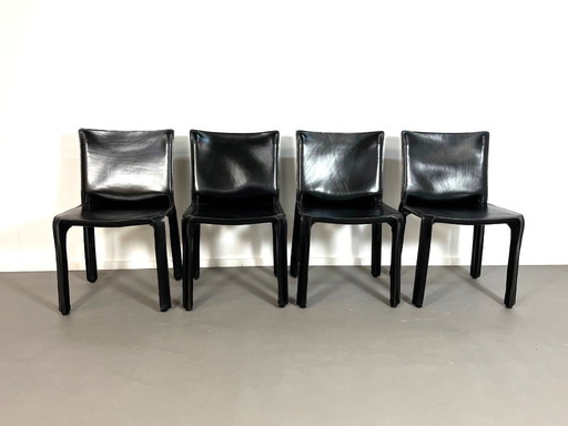 4 Black leather CAB 412 dining chairs by Mario Bellini for Cassina, 1980s.
