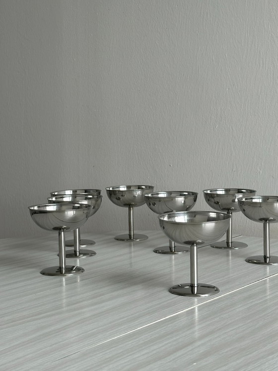 Image 1 of 8 bowls on stainless steel stand