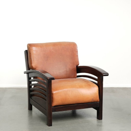 Elegant cowhide armchair with beautiful details in timeless Art Deco design