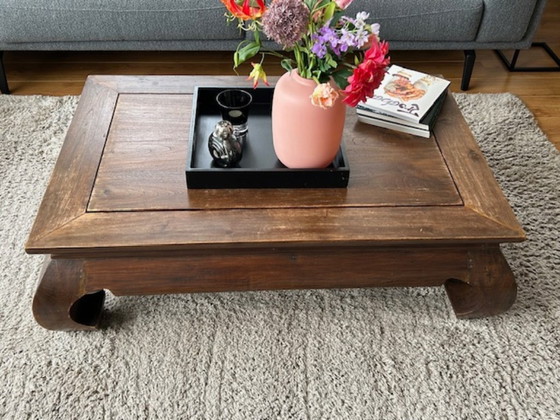 Image 1 of Wooden coffee table with opium-style legs