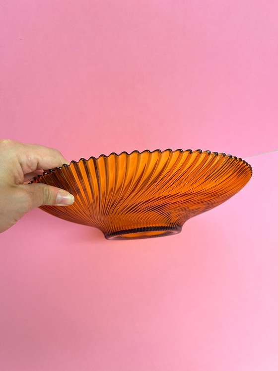 Image 1 of Vintage 70s swirl amber glass amber sunburst fruit bowl sawtooth edge orange