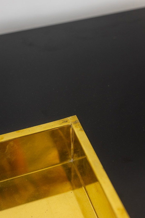 Image 1 of Willy Rizzo. Mesa de centro de madera lacada en negro y latón dorado. Años 70.