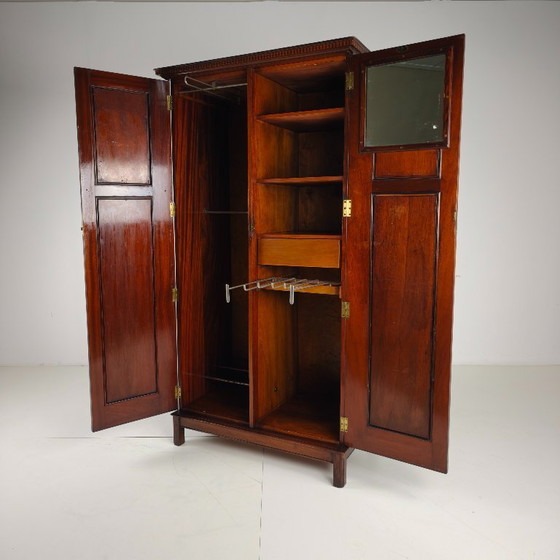 Image 1 of Men's clothing by Maple & Co. from the early 20th century.