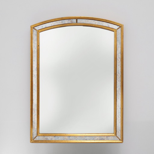 Mirror by Deknudt with marbled fume glass side panels in gilded wooden frame
