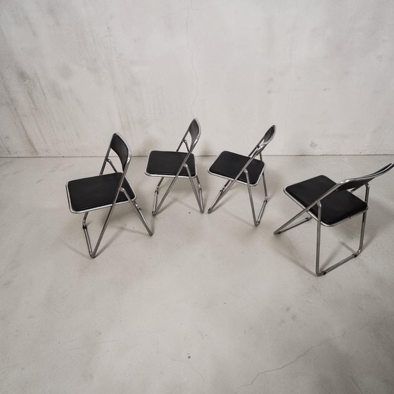 Image 1 of Set van 4 opklapbare stoelen in chroom- en leerstijl uit het midden van de 20e eeuw, Italië, jaren 70.
