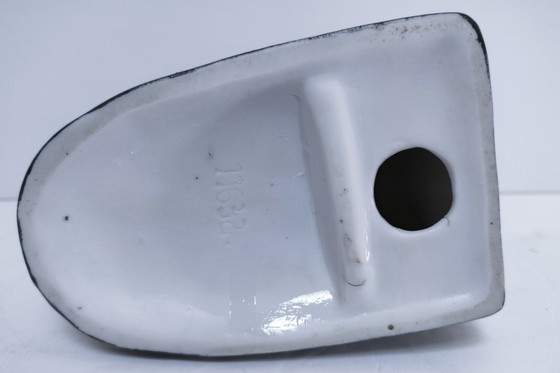 Image 1 of Genummerde porseleinen boekensteun met foxterriërmotief