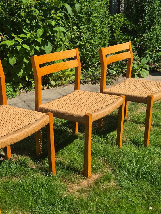 Image 1 of 4 Stuks J.L. Møller Model 401 eikenhouten eetkamerstoelen met papercord zitting
