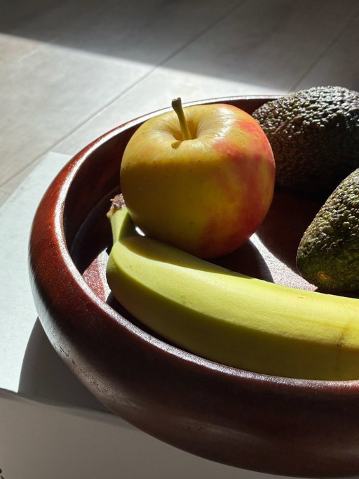 Round wooden fruit bowl