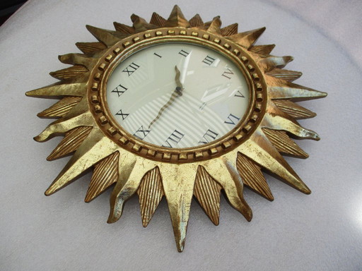 Karlsson Sun clock gilt 22k gold heavy wall clock from late 20th century works fine.