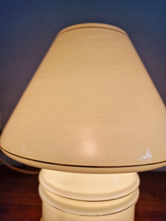 Image 1 of Vintage table lamp by Massive, with a glass base and shade.

With gold accents