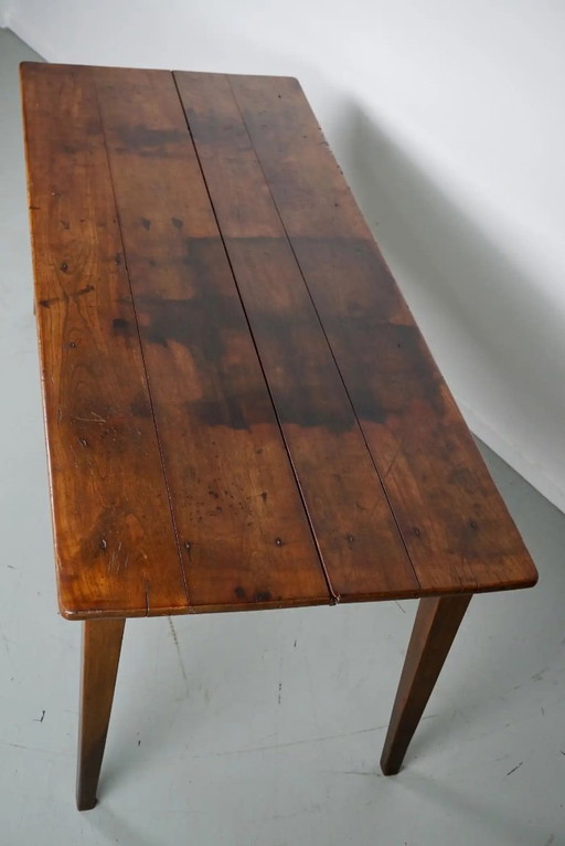 This French console table was designed and made around the end of the 19th century from marble and cast iron. The table is in