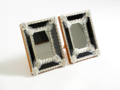 Two beautiful Venetian Mid-Century Modern table mirrors with Murano glass rosettes. Made in Italy.