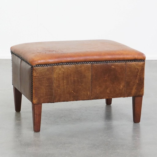 Hocker vintage en cuir de mouton