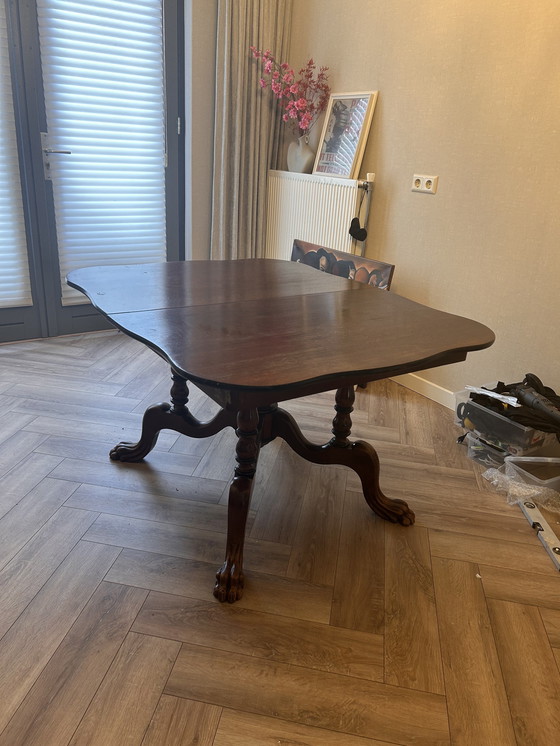 Image 1 of Table à manger extensible ancienne – bois massif – pieds griffes – pièce de caractère