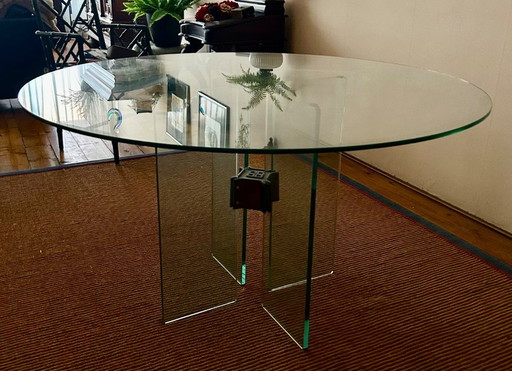 Glass dining table by Peter Ghyzcy.