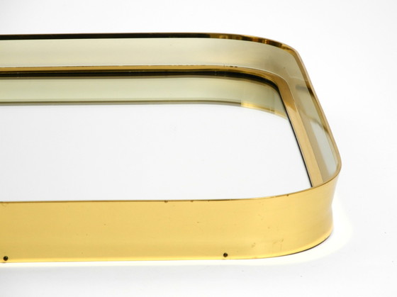 Image 1 of Prachtige originele Mid Century Moderne "Zier-Form" wandspiegel met zware messing lijst door "Münchener Zierspiegel".