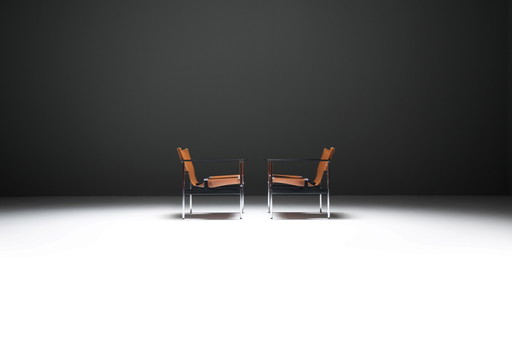 Stunning pair of Pollock Armchairs in leather by Charles Pollock for KNOLL Int.